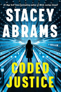 Cover of Coded Justice shows the silhouette of a woman standing in a corridor surrounded by silvery walls studded with lights.