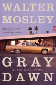 Cover of Gray Dawn shows a sixties-era car parked in front of a mid-century modern house with palm trees in the background.