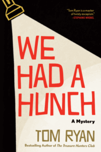 Cover of We Had a Hunch shows the title and author's name illuminated by a flashlight against a black background. 