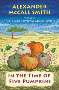 Cover shows five pumpkins lying in a sandy field with hills and a tree in the background.
