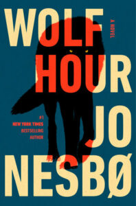Cover shows the black shape of a wolf with yellow eyes against a dark blue background.
