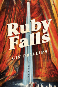 Cover of Ruby Falls shows a waterfall in a cave that has reddish-brown rock walls and a pool of water at the bottom where small figures are clustered.