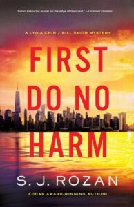 Cover shows the Manhattan skyline from the water at dawn, with the sky and reflecting water tinted with shades of gold and purple