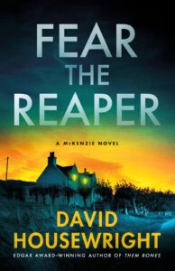 Cover of Fear the Reaper shows a country house, its lights lit up, surrounded by an orchard against a setting sun and dark skies.
