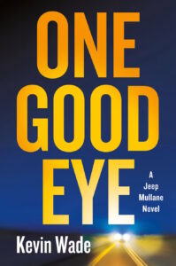 Cover of One Good Eye is largely filled with the title in yellow against a deep blue sky, with a car's headlights on a straight road approaching at the bottom.