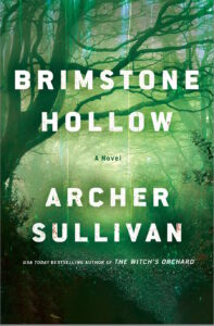 Cover of Brimstone Hollow shows a leafless tree leaning over a wooded stream in spooky shades of green.